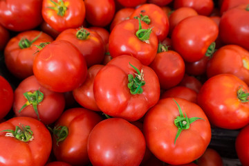 red tomatoes at the market. Fresh ripe tomatoes