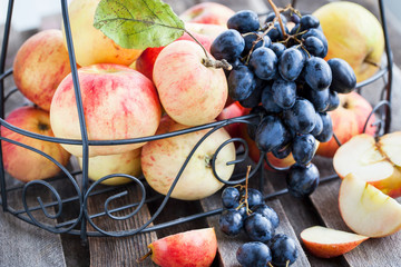 Fresh red apples and dark grape