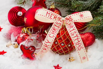 red  ball with merry christmas ribbon