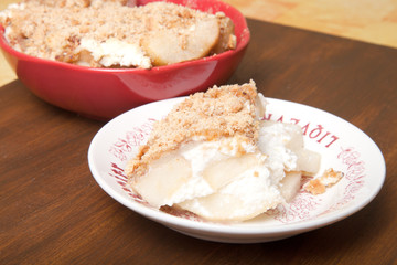 Baked pear with honey, cinnamon, brown sugar, ricotta cheese and