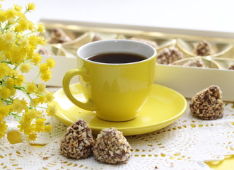 Cup of coffee and candeis