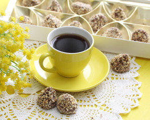 Cup of coffee and candeis