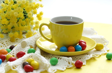 Cup of coffee and candeis
