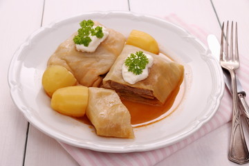 Stuffed cabbage rolls with potato, sour cream
