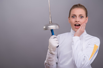 Young woman engaging in fencing