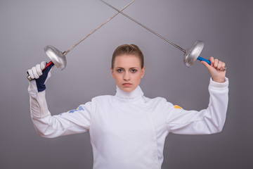 Young woman engaging in fencing