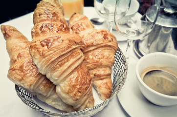 Breakfast with coffee and croissants