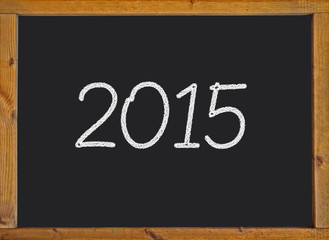 2015 written on a small blackboard with a wooden frame