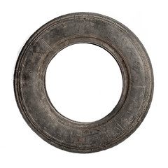 Small old dirty tire isolated