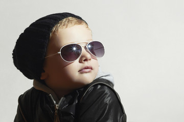 Fashionable little boy in sunglasses.Child.Winter Kids fashion