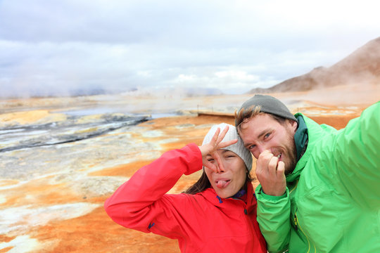 Iceland funny tourists selfie at mudpot hot spring