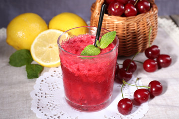 Fresh cold cherry cocktail with mint and lemon
