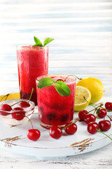 Fresh cold cherry cocktail with mint and lemon