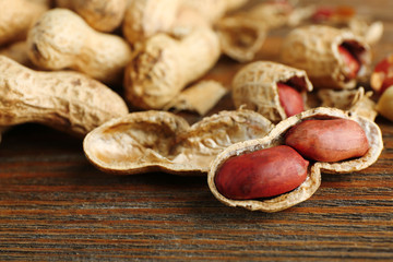 Peanuts on wooden background