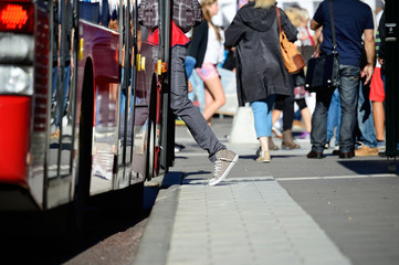 Person enters bus
