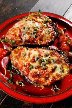Roasted eggplant stuffed with tomatoes, cheese and herbs