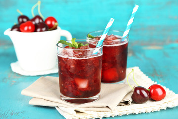 Closeup of cherry granita in glasses, on color wooden