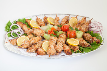 Platter with chicken shish kebab with vegetables