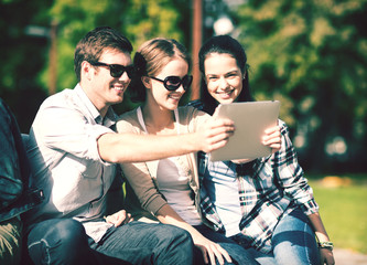 Fototapeta premium teenagers taking photo outside