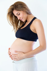 Beautiful pregnant woman. Isolated over a white background