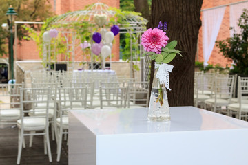 Purple dahlia at a wedding reception