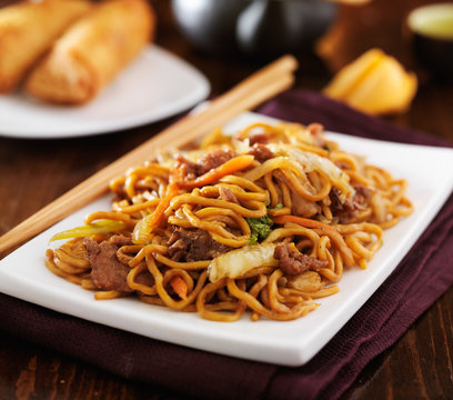 stirfried chinese beef lo mein with chopsticks
