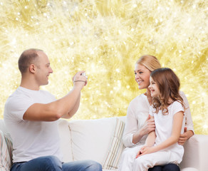 happy family with camera at home