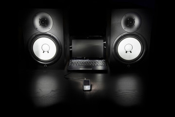 Composition with Mp3 player, laptop and speakers