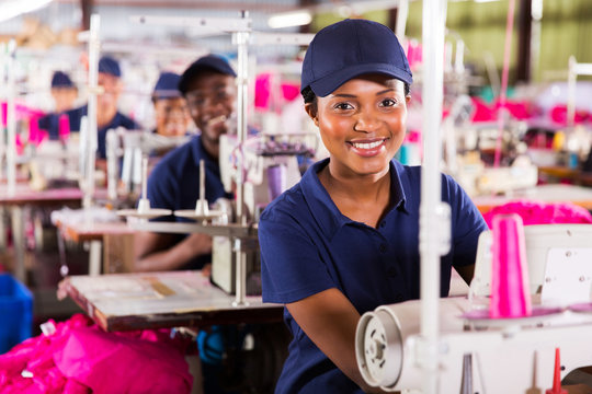 young african textile worker in factory