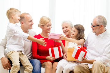 smiling family with gifts at home