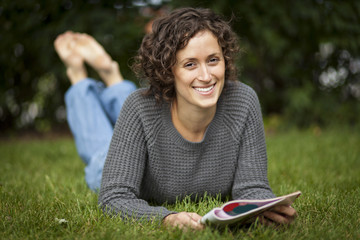 Woman Reading At The Park