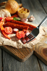 Smoked thin sausages and vegetables