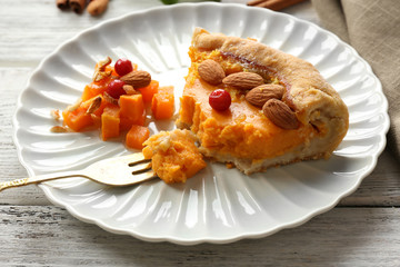 Homemade pumpkin pie on table