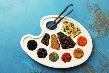 Painting palette with various spices and herbs,