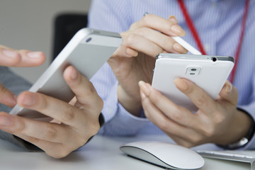 Two women to check the mobile phone during breaks