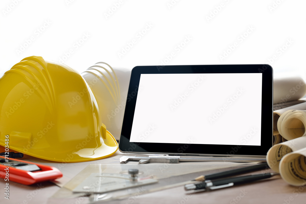 Wall mural tablet computer with construction tools and blueprints