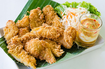 Fried fish fillet with vegetables on white background