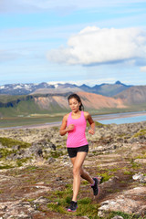 Naklejka na ściany i meble Athlete runner woman running in nature
