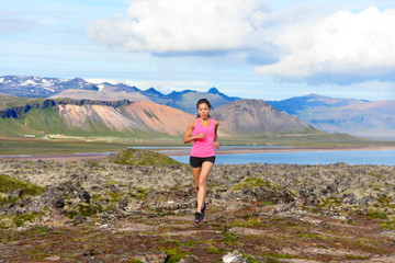 Fototapeta premium Runner woman trail running in nature