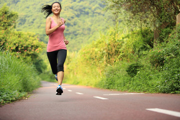 fitness woman runner running on trail