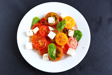 tomatoes with feta in salad top view