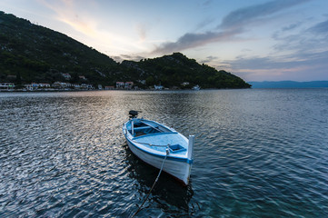Fototapeta na wymiar Small fishing boat at sunset - Mljet Island, Croatia