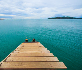 Wooden bridge into the sea