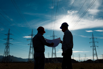 workers discussing blueprint