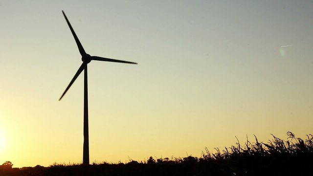 Wind turbine on sunset