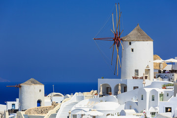 Naklejka premium Windmill at the village of Oia in Santorini, Greece