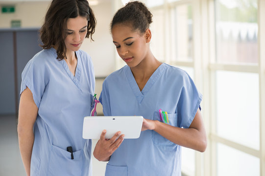 Female nurses watching clip on a digital tablet