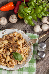 Pork stew with mushrooms, basil and red pepper.