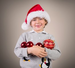Composite image of festive boy smiling