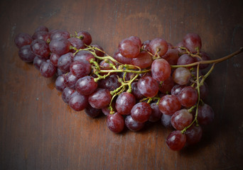 Bunch of grapes on a wooden board